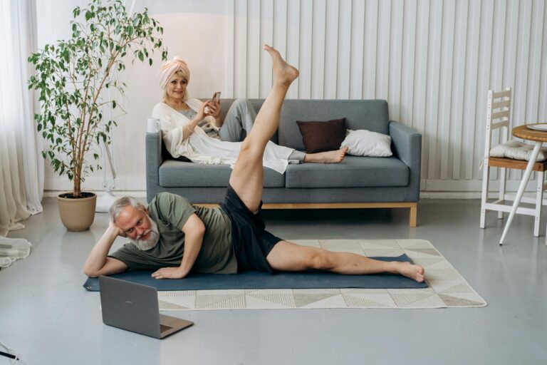 Seniors practicing yoga exercises at home for a healthy lifestyle.